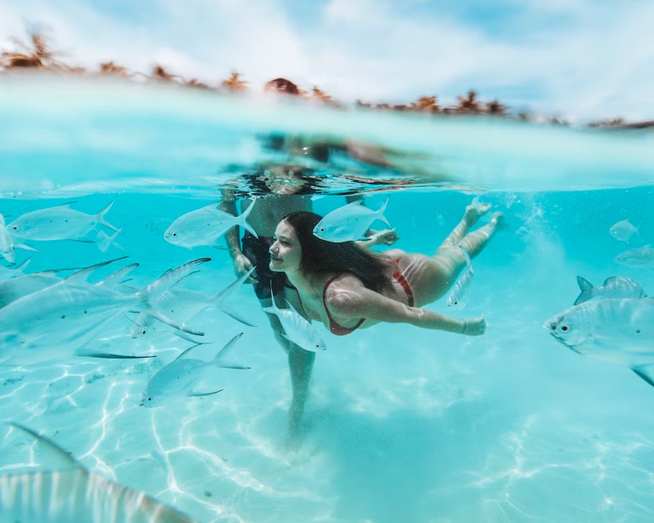 Girl snorkeling in Gili Air, turquoise transparent water