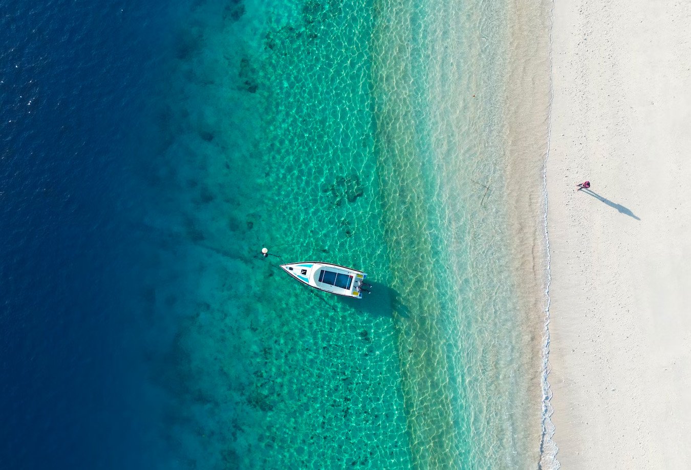 Beautiful beach in Gili Air with fishing boat